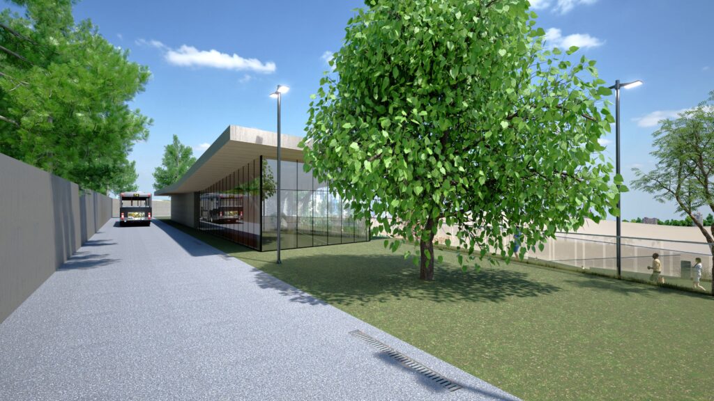 Modern school building exterior with a bus drop-off area, featuring a sleek, glass-walled structure, lush green landscaping with mature trees, and contemporary lighting, creating a welcoming and functional educational environment. By Modify Architects