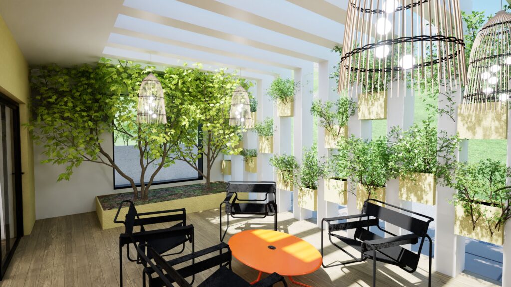 A bright and airy outdoor seating area features a modern design with black metal chairs around a vibrant orange table. Lush greenery, including trees and climbing plants, is integrated into the space, with large woven pendant lights hanging from the ceiling. White planters and vertical architectural elements add to the contemporary aesthetic, creating a relaxing and inviting atmosphere. By Modify Architects