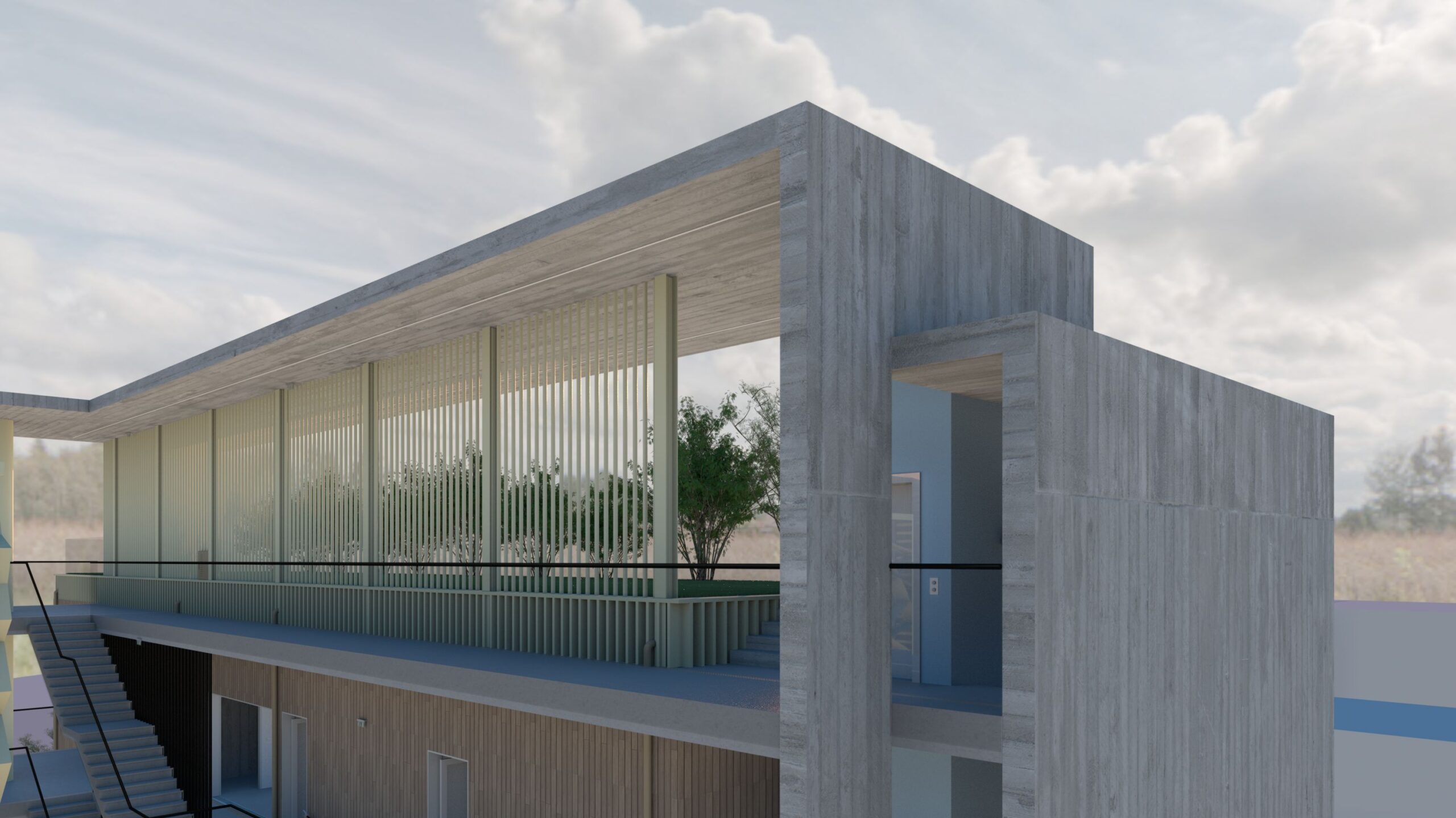 A low-angle view of the Xatzivei School's exterior, showcasing a modern architectural design with prominent concrete elements. A large, flat roof extends over a facade featuring vertical slats, providing partial shade and a sense of openness. A staircase leads up to a balcony with a dark railing. The building's textured concrete walls are contrasted by a simple doorway. Lush greenery is visible behind the slatted facade, blending the structure with the surrounding landscape. The sky is filled with fluffy white clouds, creating a bright and airy atmosphere. By Modify Architects