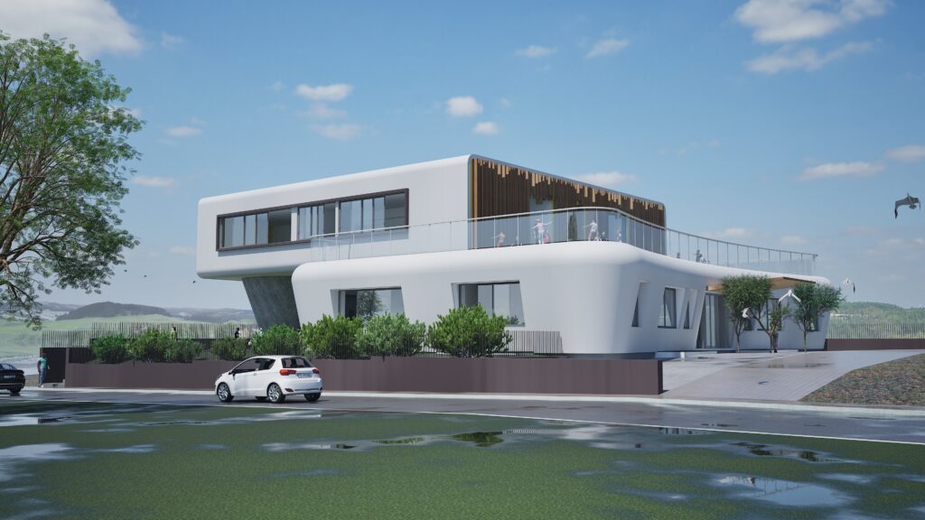 A bright, modern architectural rendering of the Zagorianakou Kindergarten-Swimming Center. The building features a striking white facade with curved elements, large windows, and a wooden accent wall on a balcony. Children are visible on the balcony, suggesting a playful and engaging environment. A dark fence surrounds the property, with lush greenery and a wet road in the foreground, under a clear blue sky with scattered clouds. A car is parked near the entrance. By Modify Architects