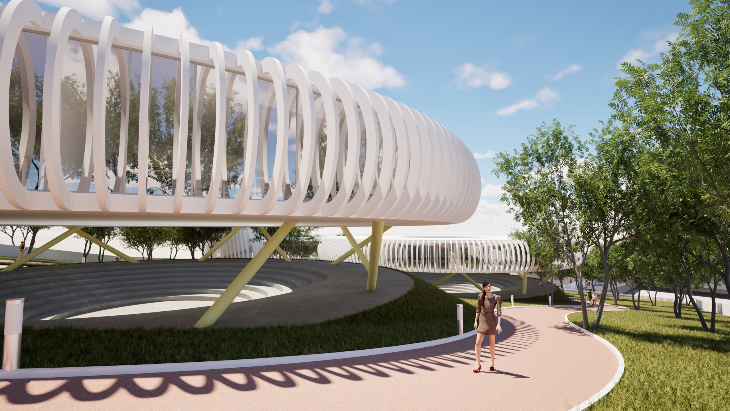 A rendering of the "Education Rings" project showcasing a modern, curved architectural structure with a white ribbed facade and green supporting columns. A pedestrian walks along a pink pathway that encircles a tiered, amphitheater-like space, surrounded by lush green trees and a bright blue sky with fluffy clouds. The design emphasizes open space and integration with the natural landscape. By Modify Architects